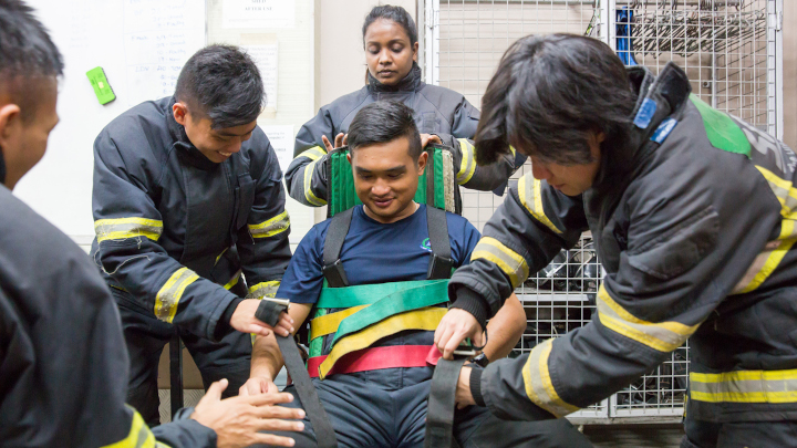 Trainee SCDF volunteer firefighters learn how to rescue casualties from road traffic accidents using the correct tools and techniques.