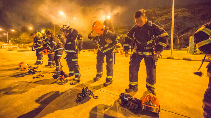 Trainee SCDF volunteer firefighter don up to 20kg worth of protective gear including a helmet, two-piece firefighting suit, fire boots, gloves and breathing apparatus.