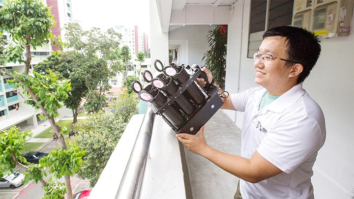 Mr Deng Lu, National Environment Agency (NEA) releasing male Wolbachia-Aedes adult mosquitos using his lightweight mosquito launcher he developed. Article Image