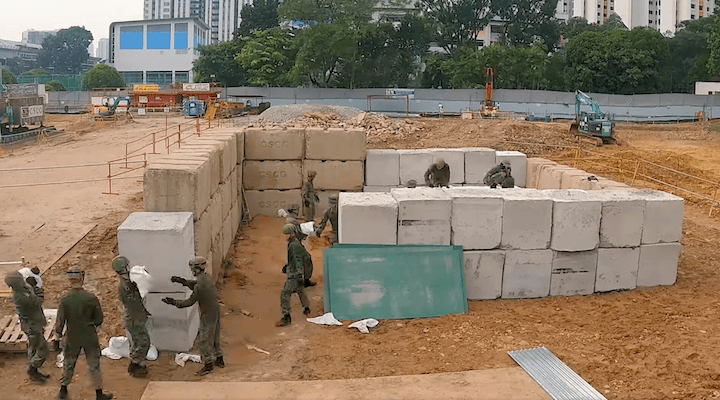 The protective barricade was made up of 55 concrete blocks and 1,000 large sandbags.